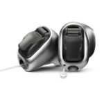 2 in ear hearing aids on top of each other in front of a white background